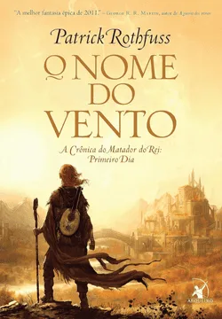 Capa do livro 'O Nome do Vento', de Patrick Rothfuss. A ilustração apresenta um homem de costas, observando uma cidade encantada, convidando o leitor a mergulhar em uma das histórias mais cativantes da fantasia, um dos 10 melhores livros de fantasia para 2025.